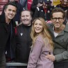 Les co-propriétaires de Wrexham, Ryan Reynolds (à droite), sa femme Blake Lively et Rob McElhenney posent avec des fans avant le match de football de la Ligue anglaise One entre Wrexham et Charlton Athletic au Racecourse ground à Wrexham, Pays de Galles, le 26 avril 2025.