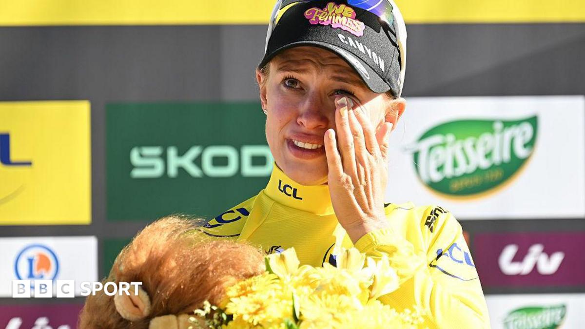 Katarzyna Niewiadoma-Phinney wipes away a tear on the podium after winning stage seven of the 2026 Tour de France Femmes